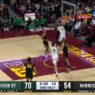 Coen Carr launches a powerful two handed slam extending Michigan States