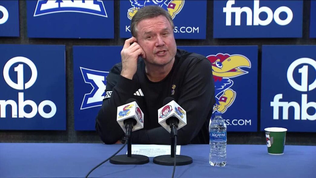 Kansas basketball coach Bill Self and players react after home