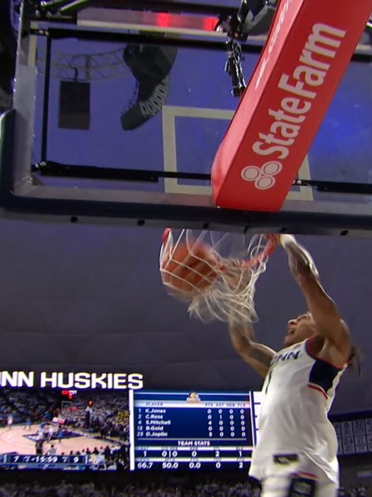 Uconns solo ball throws the vicious dunk against Marquette